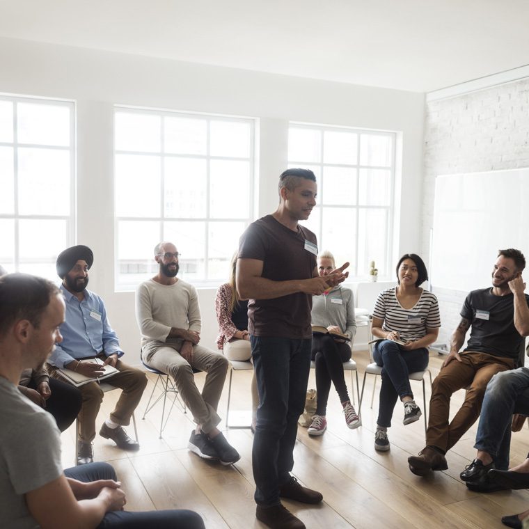 guy attending group therapy meeting