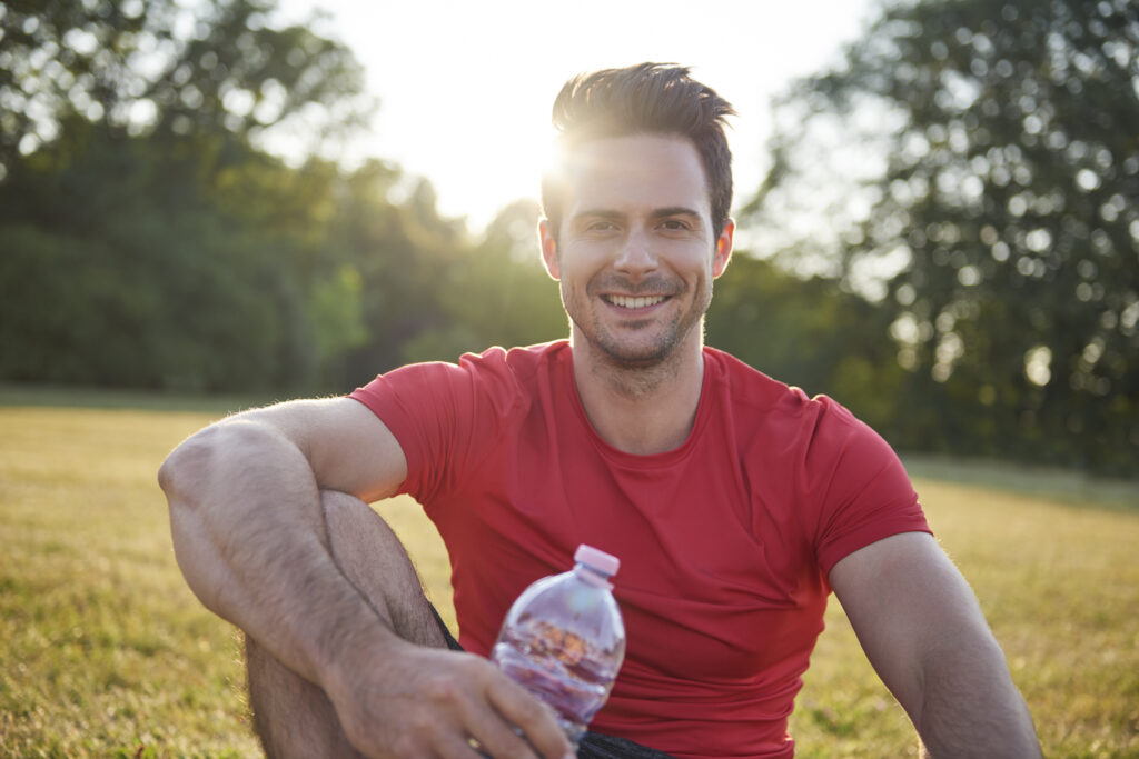 smiling man resting after workout on the fresh air 2023 11 27 05 01 36 utc nutrition,exercise,mental health